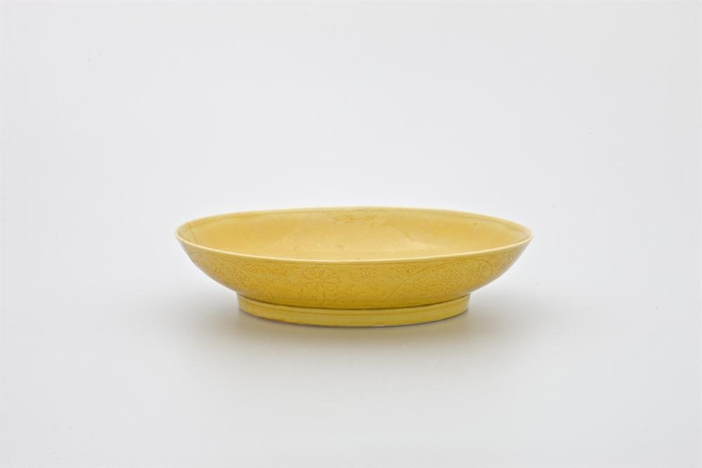 Dish, porcelain with incised decoration and yellow glaze