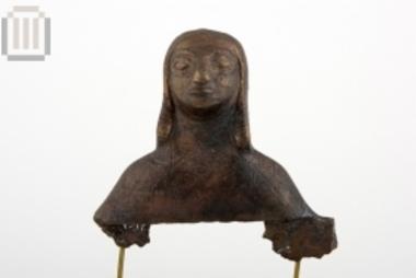Bronze two-faced bust of a winged figure decoration on the handle of a votive lebes