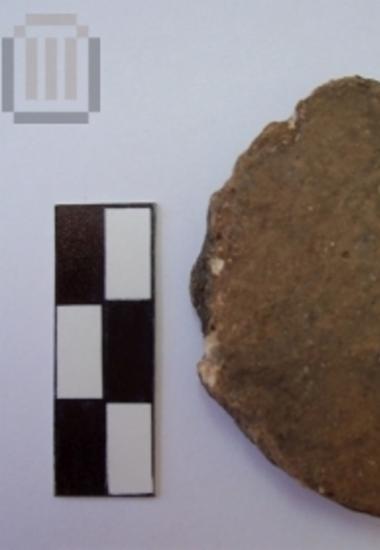 Fragment of  a round sherd disk