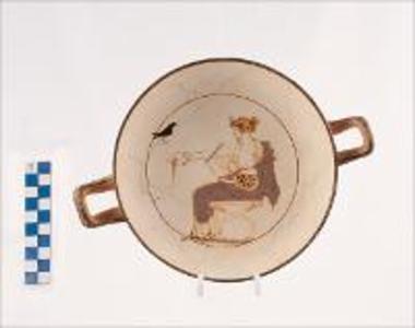 Kylix attique blanc representant Apollon jouant le lyre