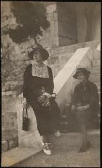 Two women sitting on steps