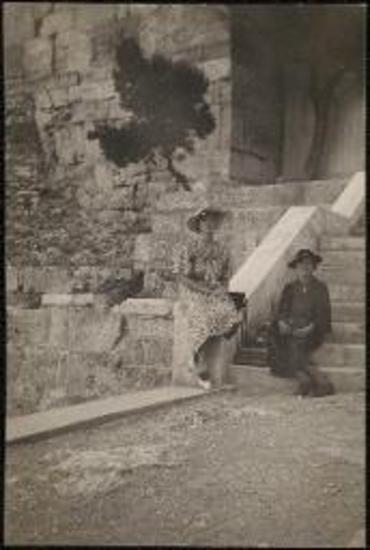 Two women (one is Doreen Canaday) sitting on steps