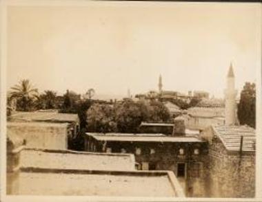 Rhodes. View over house tops to minarets