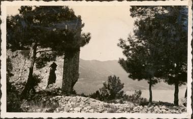 Thasos. Old, stone building with view of harbor below