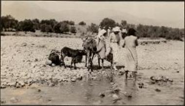 Hagia Triada. Woman starting across with donkeys