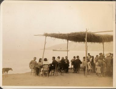 Skyros. Beachside taverna/café filled with people, and a dog