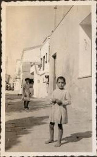 The Greek Islands Cruise, 1936. Barefoot child.