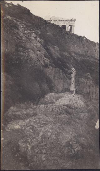 Woman standing. Hephaisteion on the background