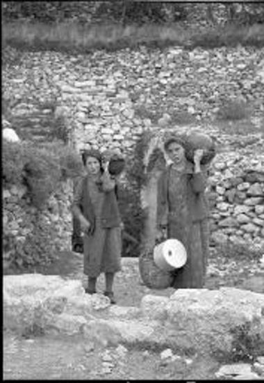 Naxos. Women carrying water-jugs