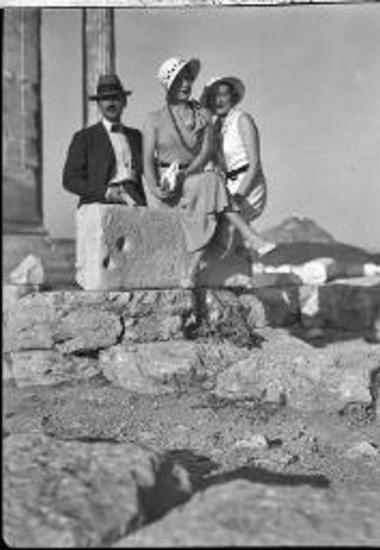 Attica, Acropolis. Two women and one man posing
