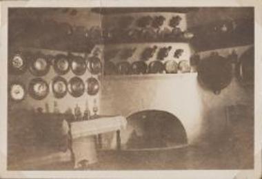 Skyros, interior fireplace with brass pots