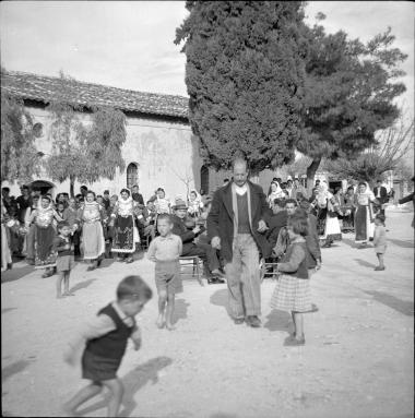 Kalamos. Children playing, women dancing