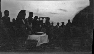 Corinth. People with priests and temple of Apollo in the background
