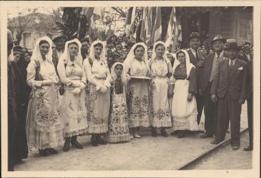 Women in traditional costume waiting to greet King George II