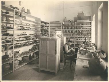 Athenian Agora Excavations. Mending room with workers mending pots.