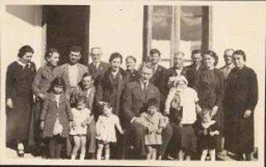 Family portait of the Lekkas family with Richard H. Howland  at the christening of Lekkas's god-child