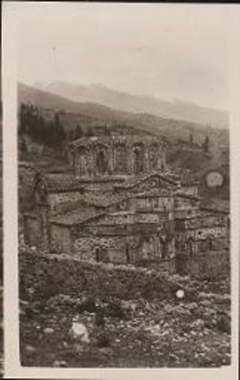 Mystras. Byzantine church with misty mountains in the disatnce.