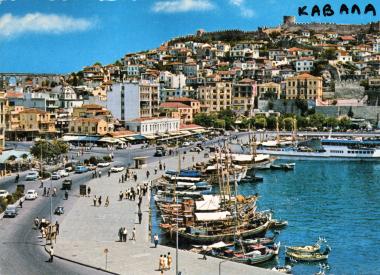 Part of the port of Kavala by boat and line vessel Kavala - Thassos. On the background, the Acropolis.