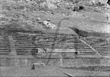 Man with a traditional costume in the stadium of Delphi