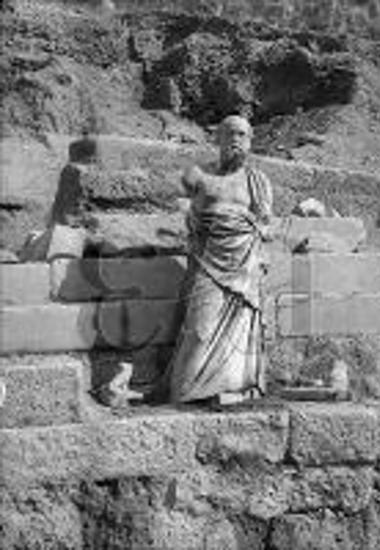 Statue of a philosopher at the terrace of the temple of Apollo