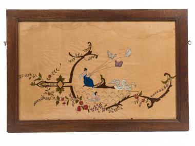 FRAMED EMBROIDERY OF A FEMALE FIGURE WITH A SMALL CHILD AMONG CREATURES OF NATURE
