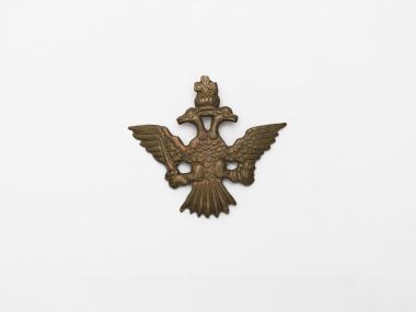 Bronze cap badge with double-headed eagle of Kapetan Makas