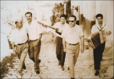 Lesbos Island (Plagia) Decade 1960: The musicians Dimitris Sterianos or Bourlis (accordion), Giannis  Sterianos or Bourlis (guitar) areplaying during a (patinada)