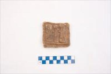 Clay tablet with three figures