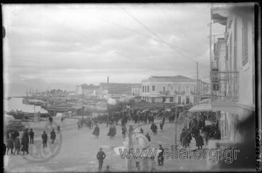 Assembled crowd at harbour.