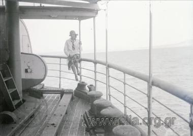Woman at the gunwale of a ship