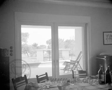 Interior view of a residence, shooting towards the porch.