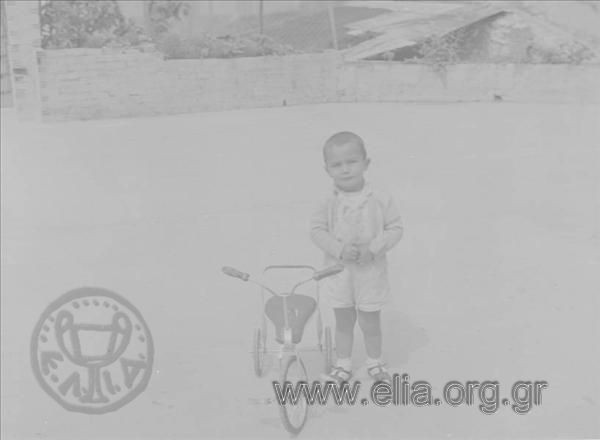Boy with a small bicycle