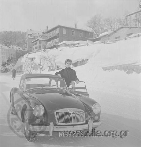Woman (member of Niarchos' family?) by a car