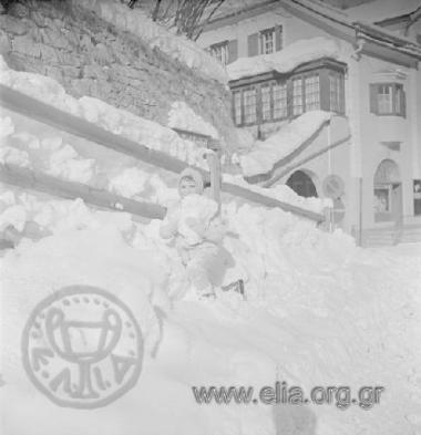 Filippos Niarchos (?) playing in the snow
