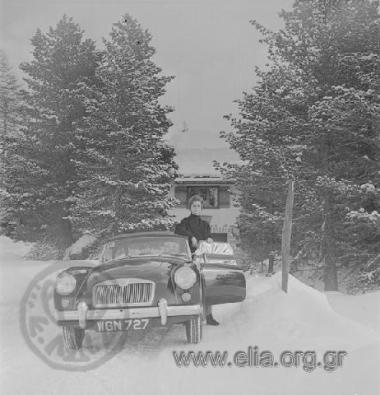 Woman (member of Niarchos' family?) by a car