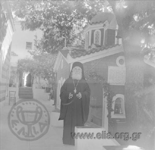 Father Timotheos next to the church, site of Agios Nektarios' grave at the Holy Trinity  Monastery-Agios Nektarios.