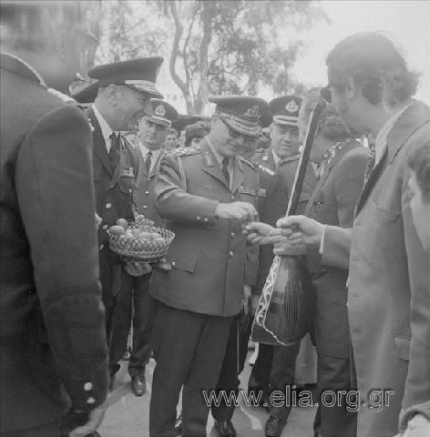 Easter celebration at a military camp. Regent Lieutenant-General Georgios Zoïtakis and Commander of the Greek Military Police Dimitris Ioannidis cracking red Easter eggs