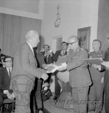 Ministry of Mercantile Marine, celebrating the recording of the two thousandth ocean-going ship in the Greek shipping register. Shipowner receiving award from the Regent, Lieutenant General Georgios Zoitakis.