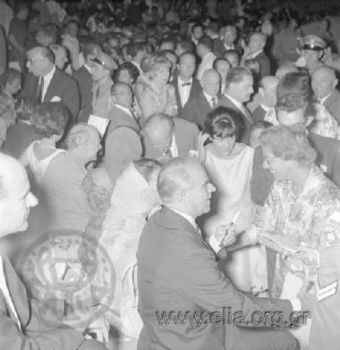 Prime Minister  Konstantinos Karamanlis with his wife Amalia at the ancient theater Luigi Cherubini's Medea starring Maria Kallas Close by, the vice president of the Council of Ministers, Panagiotis Kanellopoulos.