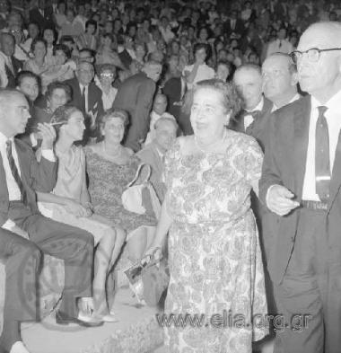 The American journalist Elsa Maxwell at the ancient theatre of Epidaurus for the performance of Luigi Cherubini's Medea, with Maria Callas. At her left, Prime Minister  Konstantinos Karamanlis, his wife Amalia and