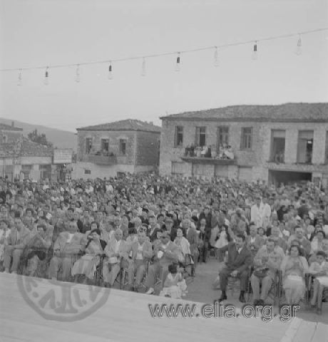Roumeliot Festival on August 15 (Religious holiday) with Giorgos Kousiadis' folk-dance group. Crowd at the square watching the event.