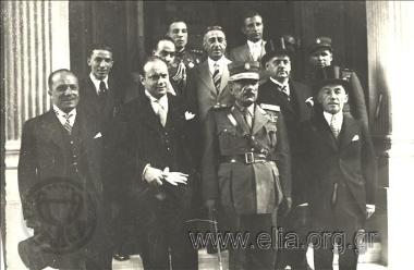 Group portrait with general Georgios Kondylis on the steps of a building.