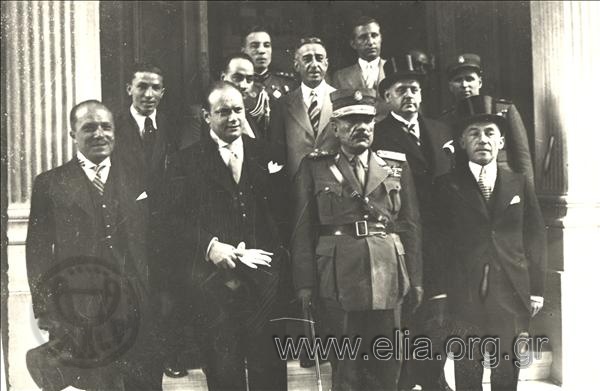 Group portrait with general Georgios Kondylis on the steps of a building.