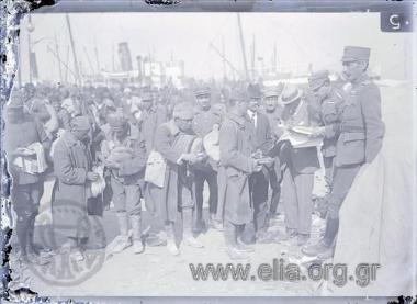 Prisoner exchange: Turkish prisoners boarding a ship going through identity control