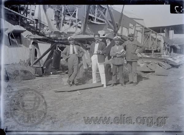 Joseph Hep and officers (?) by a destroyed airplane
