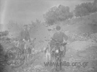 Nikolaos Makkas, N. Stavridis and Kourgerakis riding donkeys