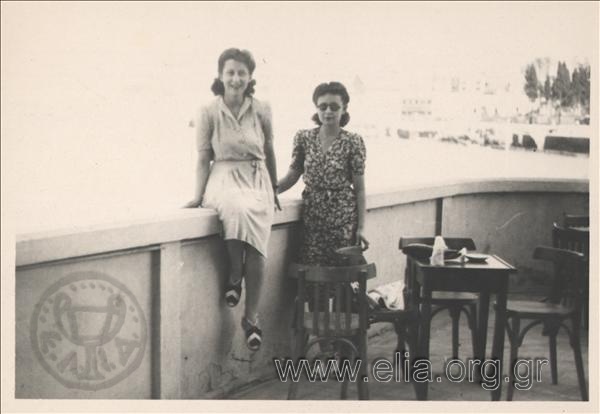 Ioulia and a woman in coffehouse's veranda