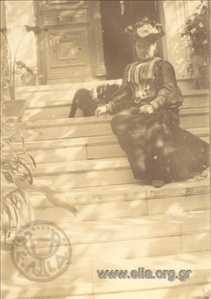 Aikaterini Zlatanou at a residence's entrance.