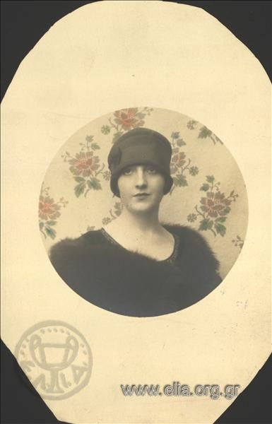 Portrait of a woman wearing fur and hat.