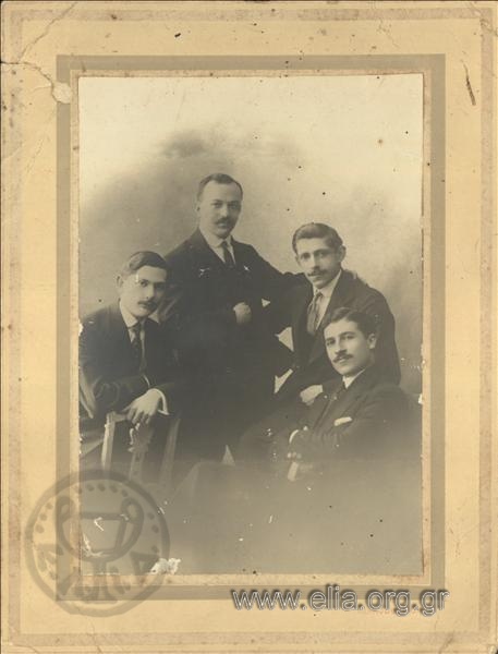 Portrait of four men.